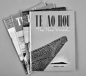 Four issues of the magazine Te Ao Hou arranged in a fan shape
